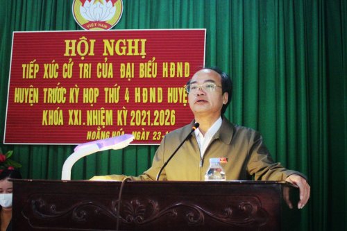 2. Ông Hoàng Ngọc Dự - Phó Chủ tịch UBND huyện báo cáo tóm tắt tình hình KTXH - ANQP năm 2021.jpg